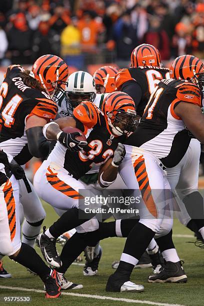 Halfback Cedric Benson of the Cincinnati Bengals rushes the ball against the New York Jets during their Wildcard Playoff game at Paul Brown Stadium...