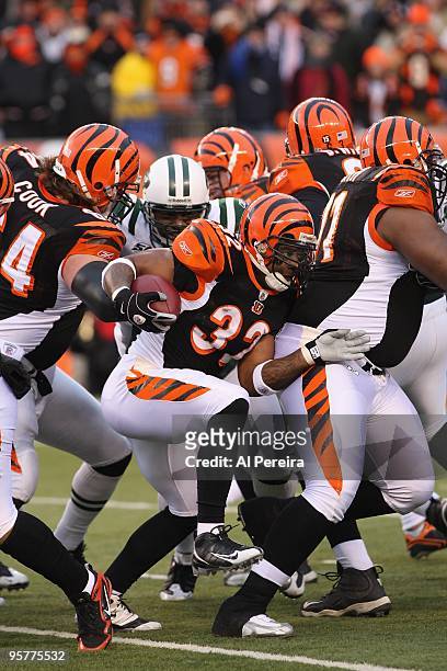 Halfback Cedric Benson of the Cincinnati Bengals rushes the ball against the New York Jets during their Wildcard Playoff game at Paul Brown Stadium...