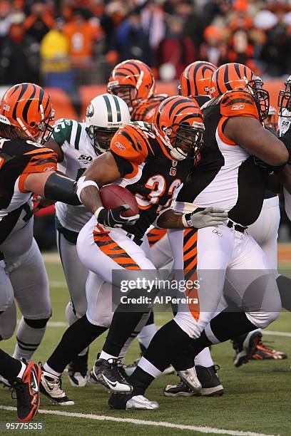 Halfback Cedric Benson of the Cincinnati Bengals rushes the ball against the New York Jets during their Wildcard Playoff game at Paul Brown Stadium...