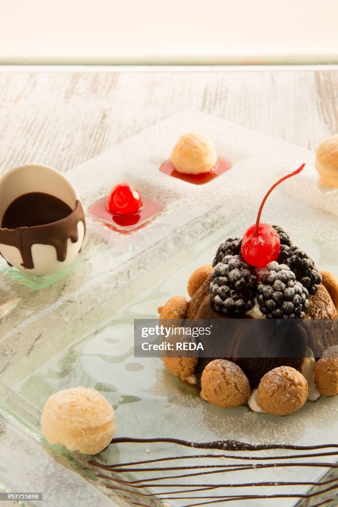 Christmas Tiramisu Dessert with Baileys Liqueur. Mulberry. Candied Cherries. Ganache of Dark Chocolate and Amaretto Elderberry