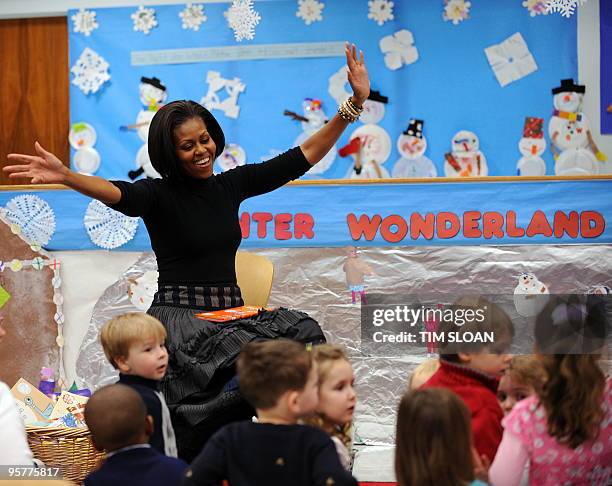 First Lady Michelle Obama reacts to a question from a child after reading them a story at the Department of Labor Day Care Center on January 14, 2010...
