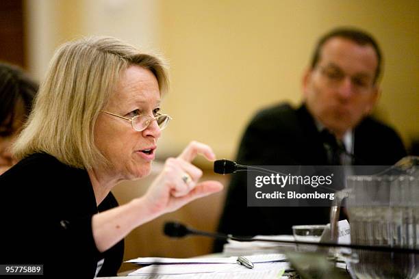 Mary Schapiro, chairman of the U.S. Securities and Exchange Commission, left, testifies before the Financial Crisis Inquiry Commission as Lanny...