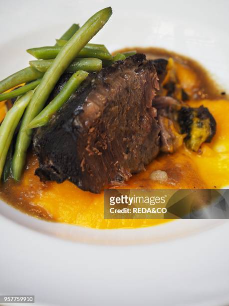 Braised pork with pumpikin cream and green beans, Lombardy, Italy, Europe.