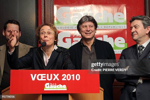 French leader of the new left wing party Front de Gauche, Jean-Luc Melenchon look on party member Martine Billard who delivers a speech during a New...