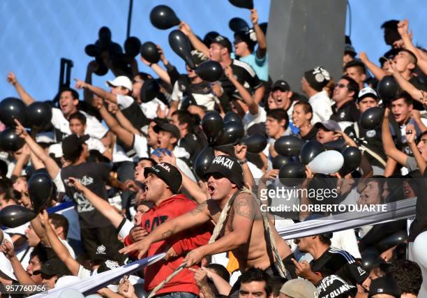 Olimpia fans cheer for their team before the start of the Paraguayan Apertura 2018 football derby against Cerro Porteno at the Defensores del Chaco...