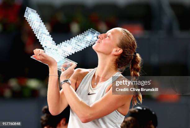 Petra Kvitova of the Czech Republic kisses her winners trophy after her three set victroy against Kiki Bertens of the Netherlands in the womens final...