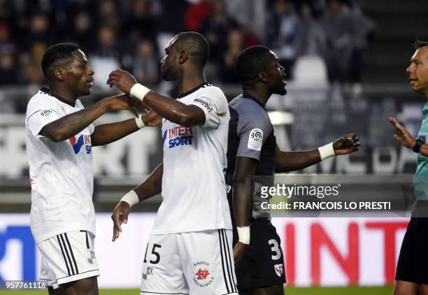 Amiens' Harisson Manzala is congratuled by teammates after scoring a goal during the French L1 football match between Amiens and Metz on May 12, 2018...
