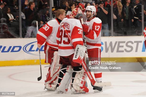 Jimmy Howard of the Detroit Red Wings is congratulated by teammate Patrick Eaves after defeating the Los Angeles Kings on January 7, 2010 at Staples...