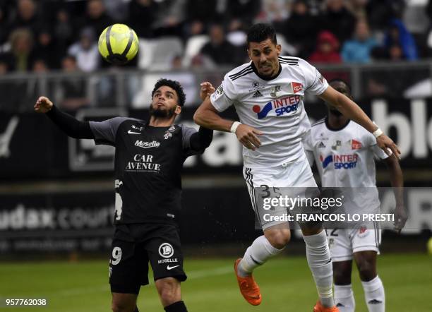 Amiens' Fernando Avelar vies with Metz's French midfielder Florent Mollet during the French L1 football match between Amiens L1) and Metz on May 12,...