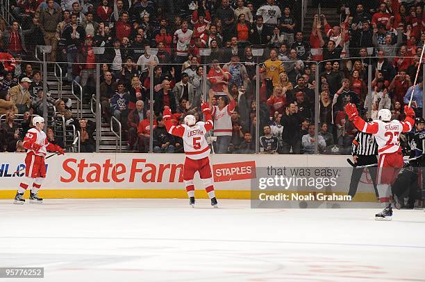 Darren Helm, Nicklas Lidstrom and Brad Stuart of the Detroit Red Wings celebrate after a goal against the Los Angeles Kings on January 7, 2010 at...