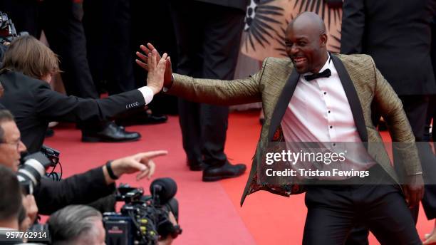 Jimmy Jean Louis greets a photographer as he attends the screening of "Sorry Angel " during the 71st annual Cannes Film Festival at Palais des...