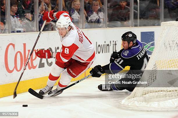 Justin Abdelkader of the Detroit Red Wings skates with the puck against Raitis Ivanans of the Los Angeles Kings on January 7, 2010 at Staples Center...