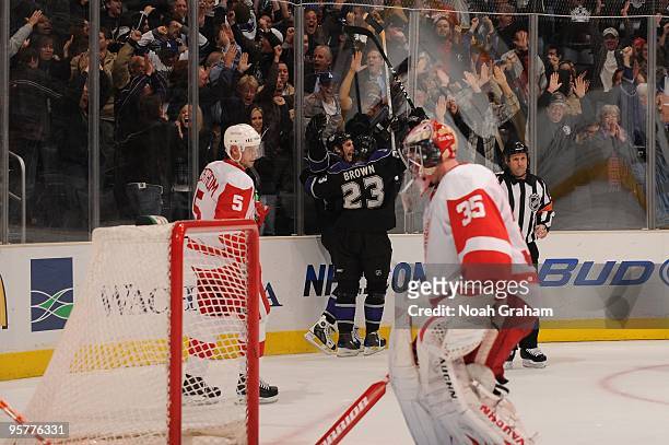 Dustin Brown of the Los Angeles Kings celebrates after a Kings goal against Jimmy Howard of the Detroit Red Wings on January 7, 2010 at Staples...