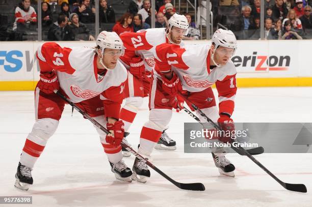 Derek Meech, Ville Leino and Dan Cleary of the Detroit Red Wings prepare for the faceoff against the Los Angeles Kings on January 7, 2010 at Staples...
