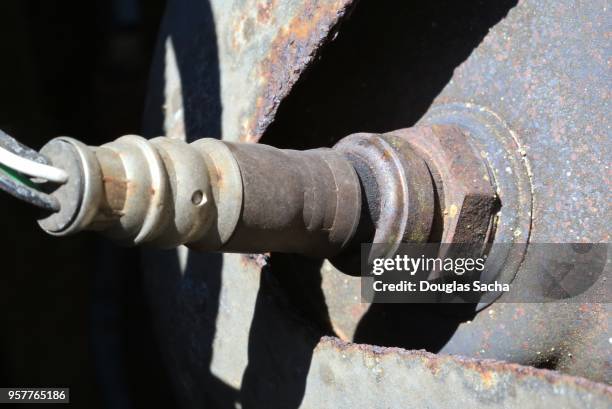 closeup of a polution sensor that used for monitoring emissions from an engine exhaust - oxygen sensor car stock pictures, royalty-free photos & images