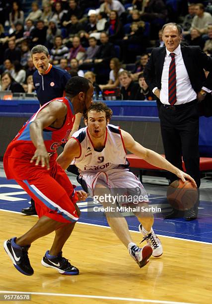 Marcelinho Huertas, #9 of Caja Laboral competes with J.R. Holden, #10 of CSKA Moscow in action during the Euroleague Basketball Regular Season...