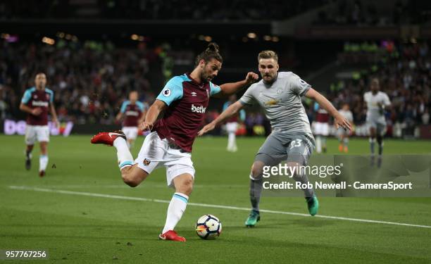 West Ham United's Andy Carroll and Manchester United's Luke Shaw during the Premier League match between West Ham United and Manchester United at...