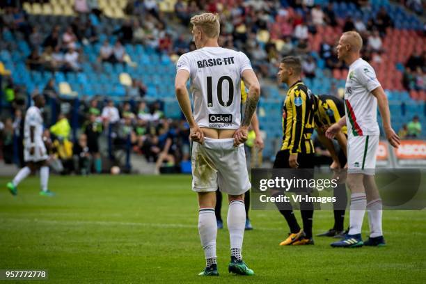 Lex Immers of ADO Den Haag shows his butt to the crowd who is calling his mother a "kankermoeder" during the Dutch Eredivisie play-offs match between...