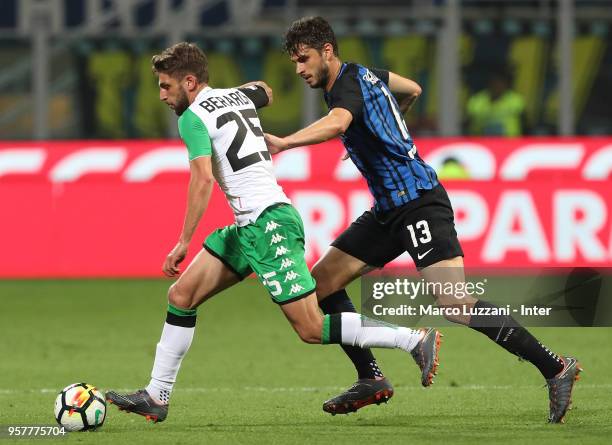 Andrea Ranocchia of FC Internazionale competes for the ball with Domenico Berardi of US Sassuolo during the serie A match between FC Internazionale...
