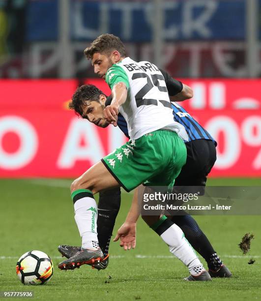 Andrea Ranocchia of FC Internazionale competes for the ball with Francesco Cassata of US Sassuolo during the serie A match between FC Internazionale...