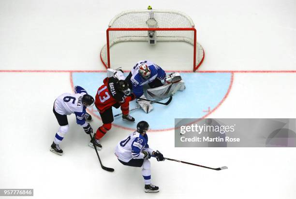 Harri Sateri, goaltender of Finland tends net against Matt Barzal of Canada during the 2018 IIHF Ice Hockey World Championship Group B game between...
