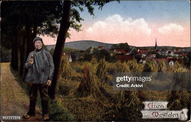 Ak Gruß aus Westfalen, Rauchender Bauer neben einem Ackerfeld, Westfalenlied; gelaufen 1922