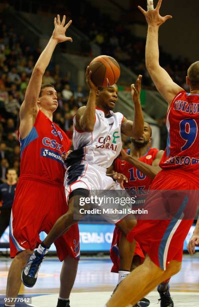 Sean Singletary of Caja Laboral competes with Sasha Kaun, #24 and Ramunas Siskauskas, #9 of CSKA Moscow in action during the Euroleague Basketball...