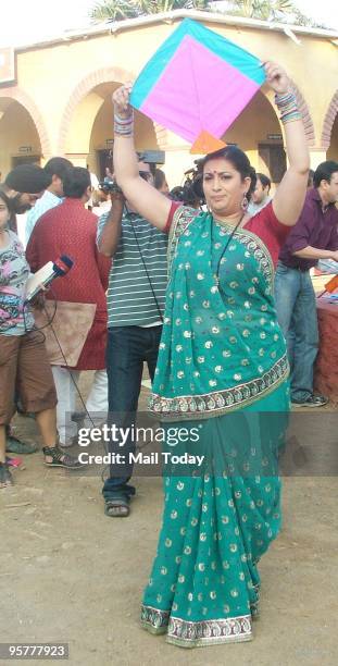 Actress Smriti Irani flies a kite at an event to celebrate Makar Sakranti in Mumbai on January 13, 2010.