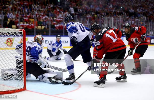 Harri Sateri, goaltender of Finland tends net against Jaden Schwartz of Canada during the 2018 IIHF Ice Hockey World Championship Group B game...