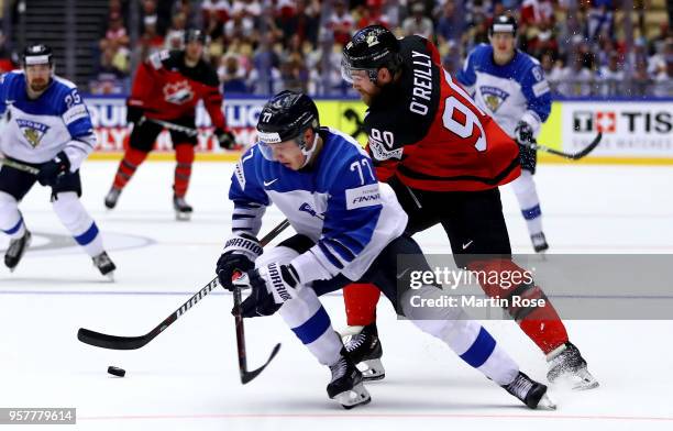 Ryan O'Reilly of Canada and Markus Nutivaara of Finland during the 2018 IIHF Ice Hockey World Championship Group B game between Canada and Finland at...