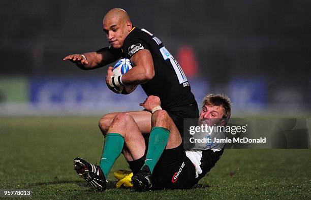 Tom Varndell of London Wasps is tackled by Giulo Toniolatti of Roma during the Amlim Challenge Cup, Round Five match between London Wasps and Roma at...