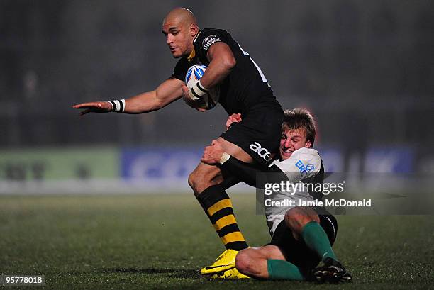 Tom Varndell of London Wasps is tackled by Giulo Toniolatti of Roma during the Amlim Challenge Cup, Round Five match between London Wasps and Roma at...