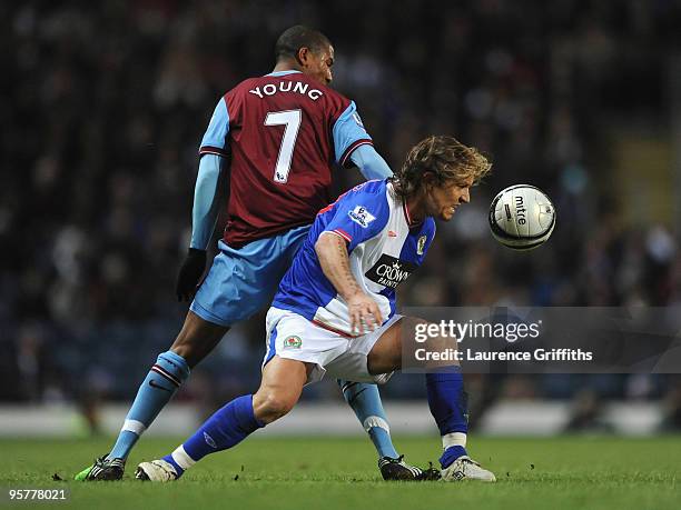 Michel Salgado of Blackburn Rovers battles for the ball with Ashley Young of Aston Villa during the Carling Cup Semi Final match between Blackburn...