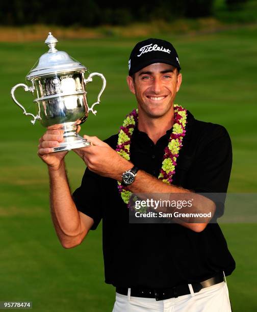 Geoff Ogilvy of Australia poses with the trophy after winning the SBS Championship at the Plantation course on January 10, 2010 in Kapalua, Maui,...