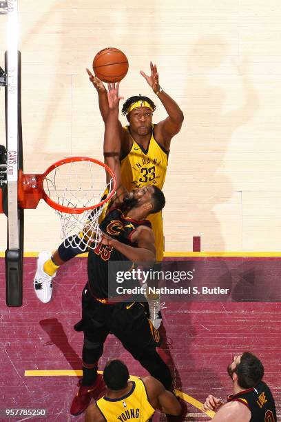 Tristan Thompson of the Cleveland Cavaliers and Myles Turner of the Indiana Pacers reach for the ball in Game Seven of Round One of the 2018 NBA...