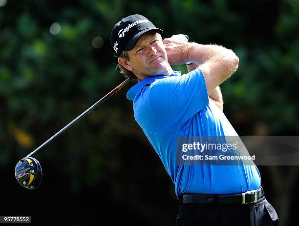 Retief Goosen of South Arica hits a shot on the 1st hole during the final round of the SBS Championship at the Plantation course on January 10, 2010...