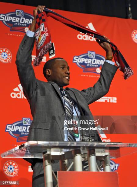 The second overall draft pick Tony Tchani of the New York Red Bulls raises his team scarf during the 2010 MLS SuperDraft on January 14, 2010 at the...