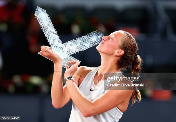 Petra Kvitova of the Czech Republic kisses her winners trophy after her three set victory against Kiki Bertens of the Netherlands in the womens final...