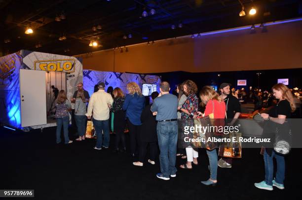 Fan wait in line for The Millennium Falcon at a press conference in Los Angeles on May 12, 2018 for "Solo: A Star Wars Story," which opens in U.S...
