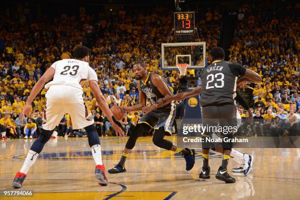 Kevin Durant of the Golden State Warriors handles the ball against the New Orleans Pelicans in Game Two of the Western Conference Semifinals during...