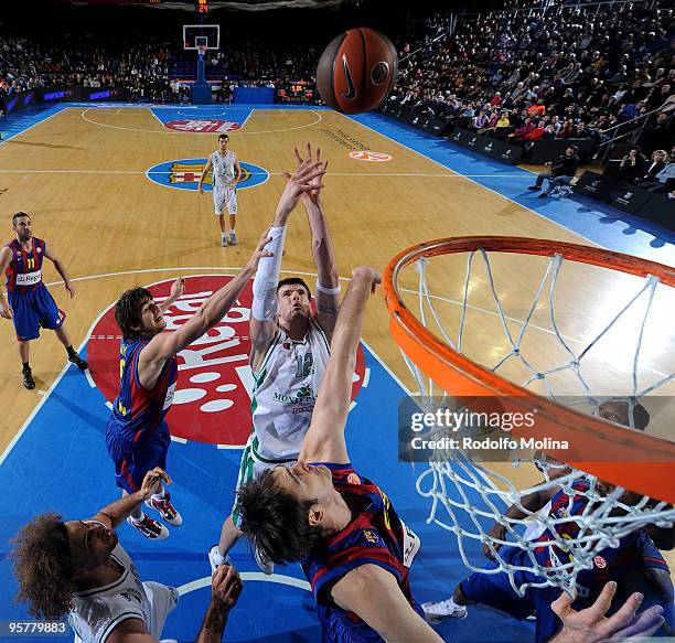 Ksistof Lavrinovic, #12 of Montepaschi Siena competes with Ricky Rubio, #9 of Regal FC Barcelona and Erazem Lorbek, #25 during the Euroleague...