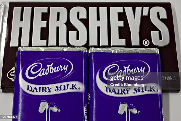 Hershey Co. Hershey's chocolate bar is displayed with Cadbury Plc chocolate bars for a photograph in New York, U.S., on Thursday, Jan. 14, 2010....