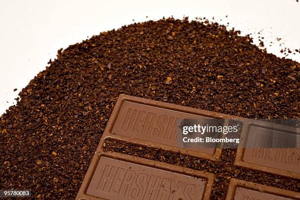 Kraft Foods Inc. Maxwell House coffee and a Hershey Co. Hershey's chocolate bar are displayed for a photograph in New York, U.S., on Thursday, Jan....