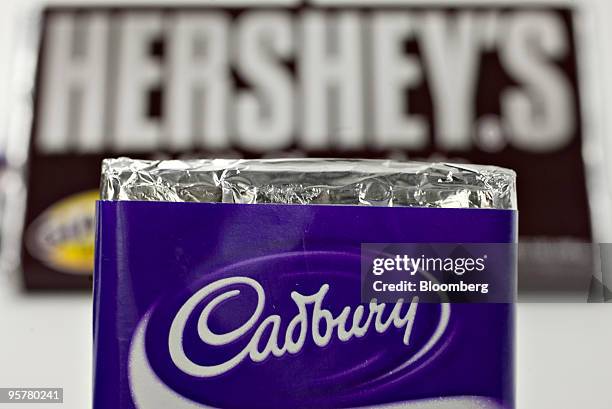 Hershey Co. Hershey's chocolate bar is displayed with Cadbury Plc chocolate bar for a photograph in New York, U.S., on Thursday, Jan. 14, 2010....