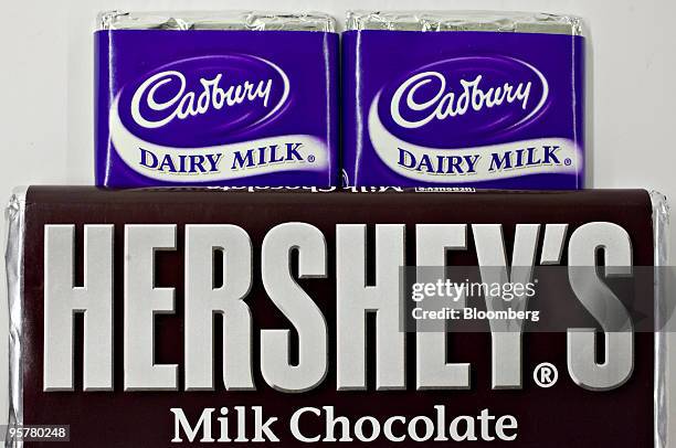 Hershey Co. Hershey's chocolate bar is displayed with Cadbury Plc chocolate bars for a photograph in New York, U.S., on Thursday, Jan. 14, 2010....