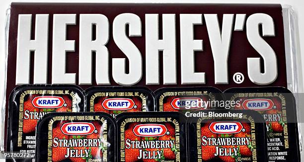 Kraft Foods Inc. Strawberry jelly is displayed for a photograph with a Hershey Co. Hershey's chocolate bar in New York, U.S., on Thursday, Jan. 14,...