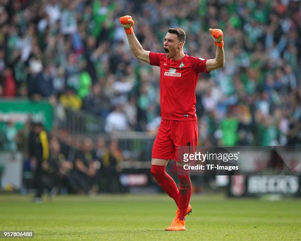 Goalkeeper Jiri Pavlenka of Bremen celebrates after Thomas Delaney of Bremen scored their team`s first goal during the Bundesliga match between SV...