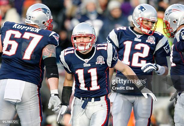 Julian Edelman of the New England Patriots reacts after he scored a touchdown against the Baltimore Ravens during the 2010 AFC wild-card playoff game...