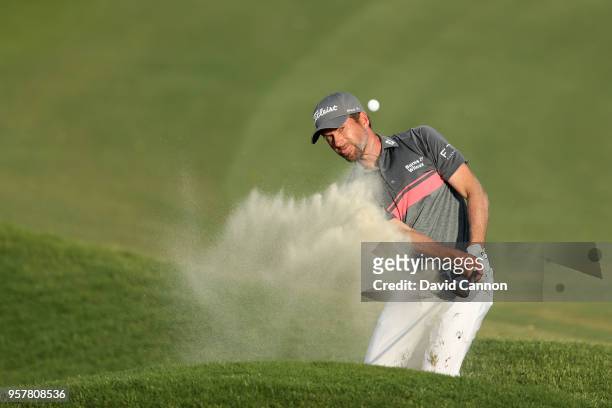 Webb Simpson of the United States plays his third shot on the par 4, 18th hole during the third round of the THE PLAYERS Championship on the Stadium...