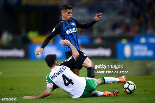 Joao Cancelo of FC Internazionale is tackled by Francesco Magnanelli of US Sassuolo during the Serie A football match between FC Internazionale and...